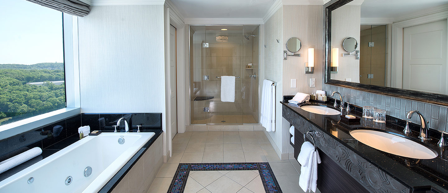 Luxury Bathroom with marble, large Bathtub, and scenic view